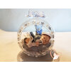 Bébé fille dans sa bulle - boule de noël - au cœur des arts