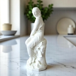 Minton. John Bell. Miranda. Figure en biscuit représentant une femme sur un rocher, XIXe siècle