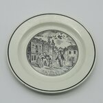 Sarreguemines. Assiette en faïence à décor d'une scène de village, XIXe siècle