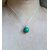 Pendentif "Simplissimes" en argent massif et malachite, vue porté, à la lumière du jour