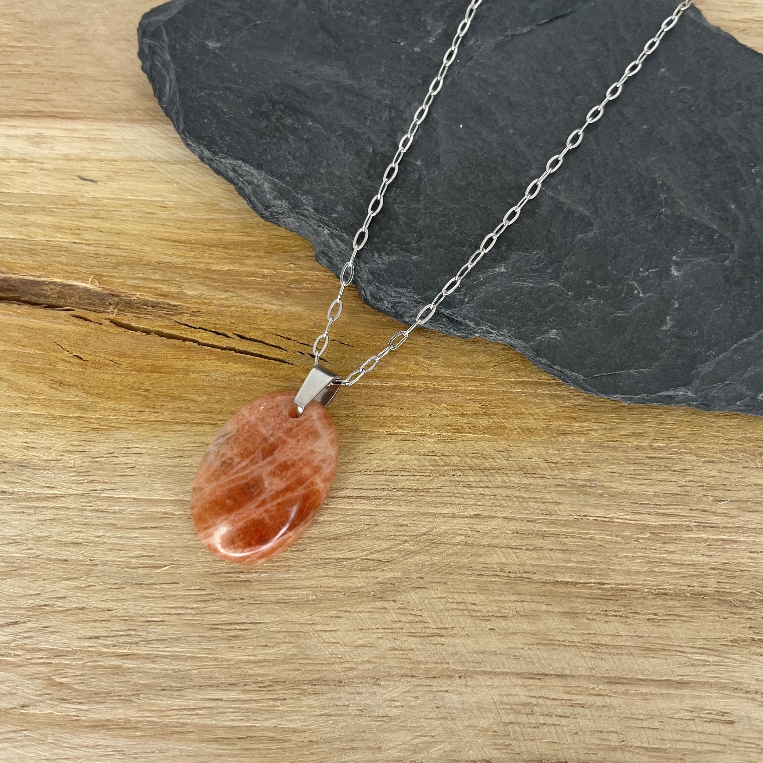 Pendentif pierre de soleil forme goutte bélière acier inoxydable