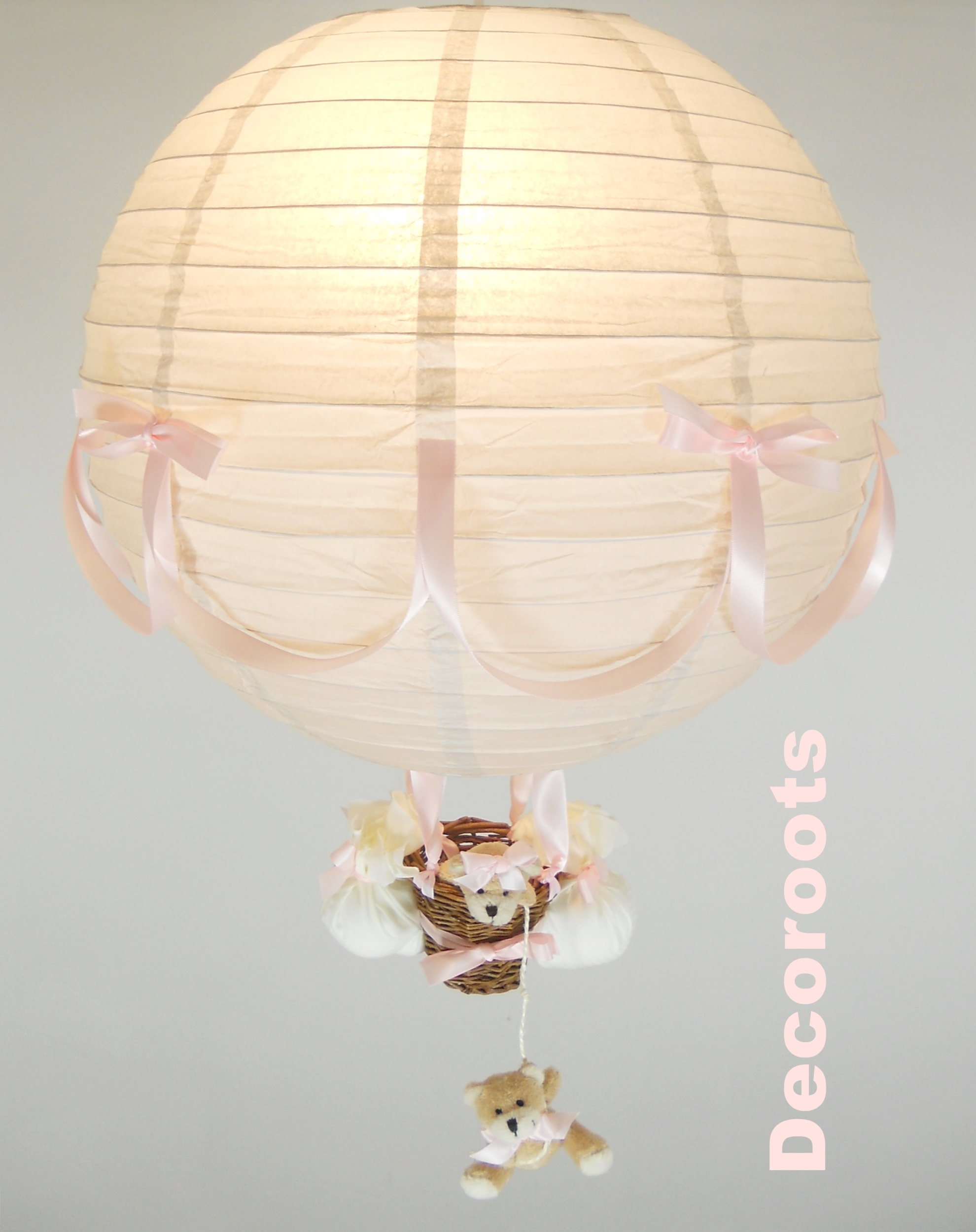 lampe montgolfière rose et gris allumée