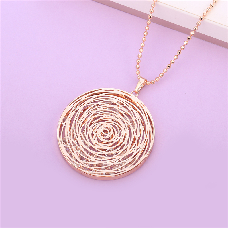 grand pendentif doré avec strass à lintérieur