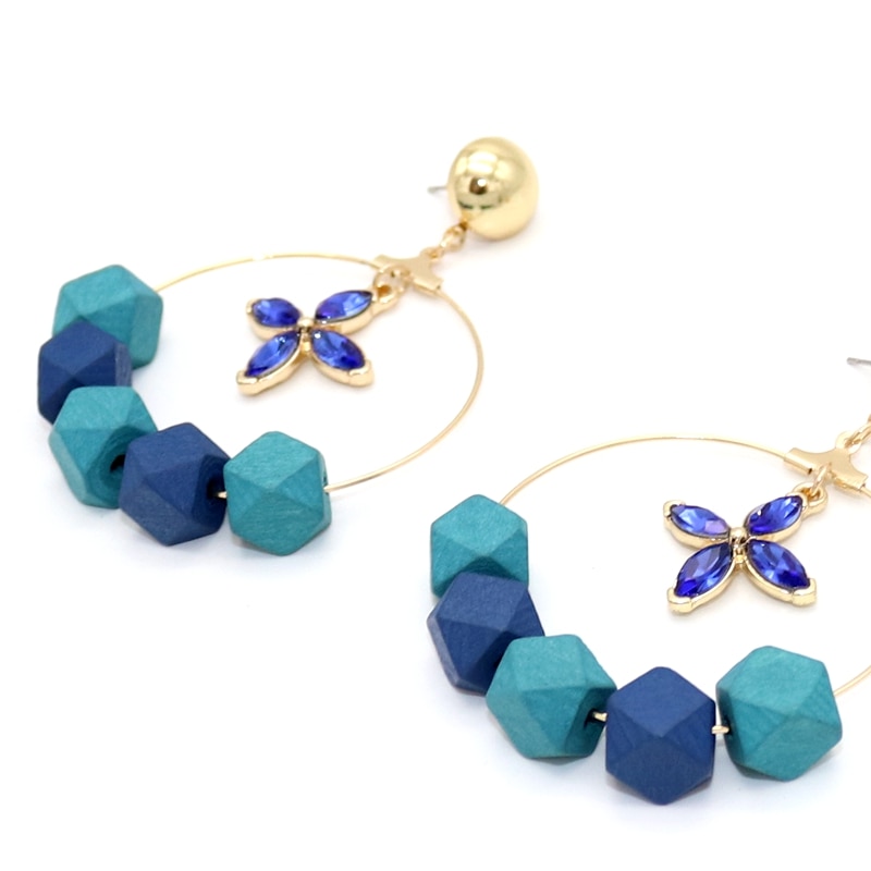 boucles doreilles créoles bleus en bois avec fleur