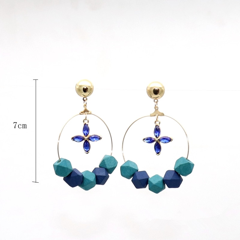 boucles doreilles créoles bleus en bois avec fleur