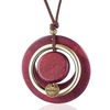 sautoir avec pendentif cercles en bois et métal rose