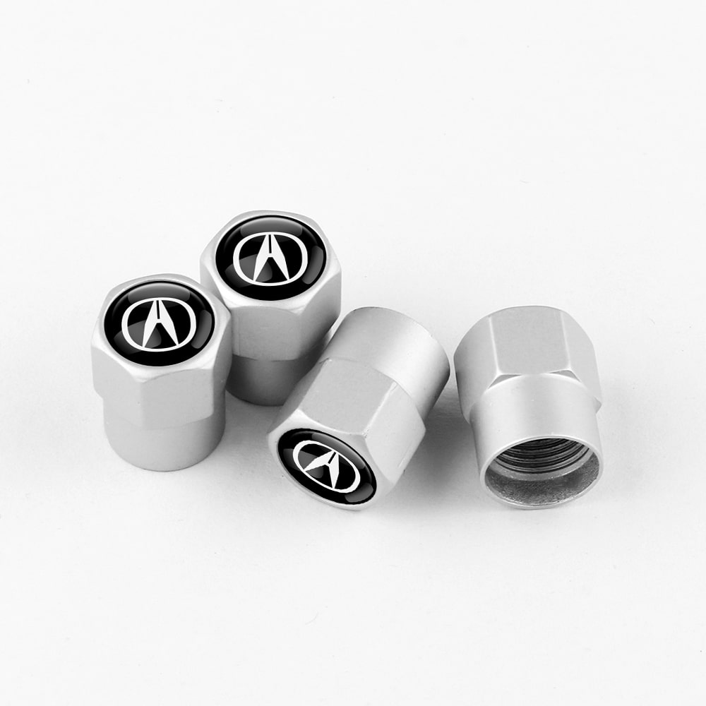 Lot de 4 bouchons de valve argentés ACURA sur fond blanc