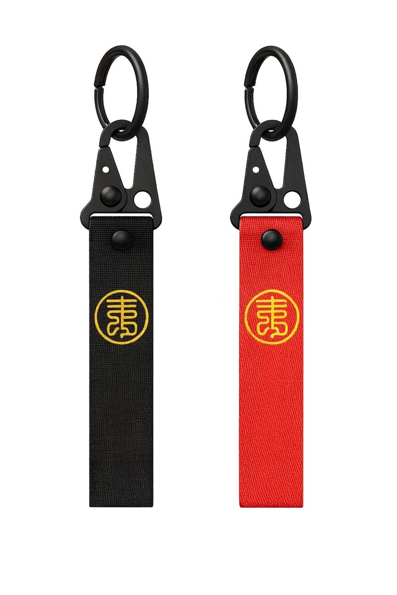 Porte-clés en sangle nylon noir et rouge avec logo asiatique doré, anneau métallique et mousqueton noir