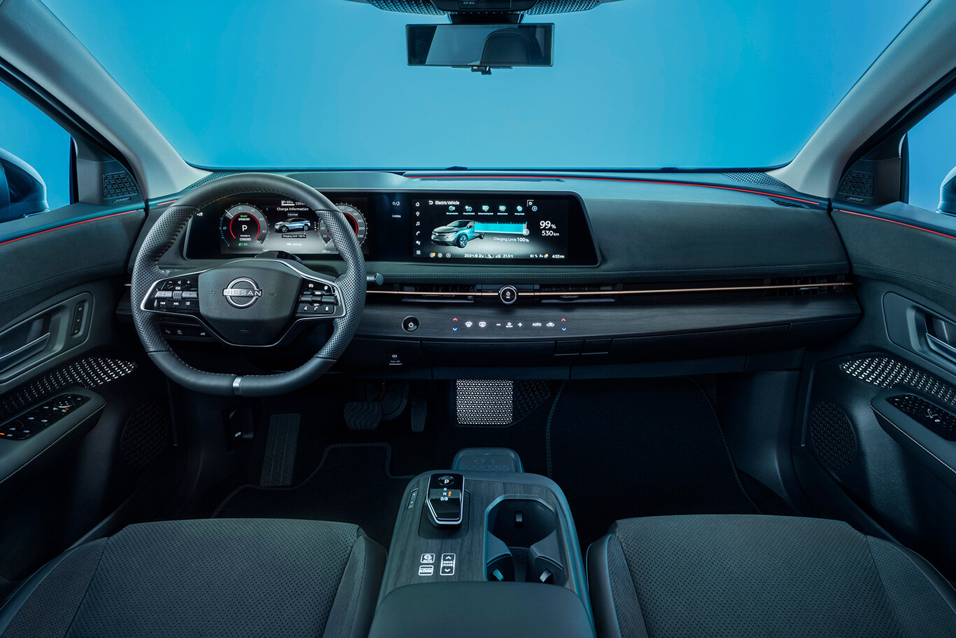 Habitacle moderne du Nissan Ariya avec volant double écran numérique et console centrale