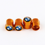 4 capsules pour tige de valve doré avec une vue sur le filetage
