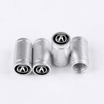 Quatre embouts de valve sport argent ACURA disposés sur fond blanc