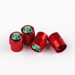 Quatre cache-valves rouges avec logo Quadrigoglio sur fond blanc
