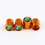 Quadrigoglio embouts de valve dorés, pack de quatre sur fond blanc