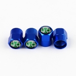 Ensemble de 4 cache-valves bleus Quadrigoglio sur fond blanc