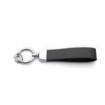 Porte-clés en cuir noir sans logo, avec anneau métallique argenté et finition chromée, présenté sur fond blanc.