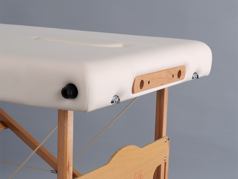 détail fixation têtière sur table de massage portable en bois aveno life habys tablelya bois naturel skai creme