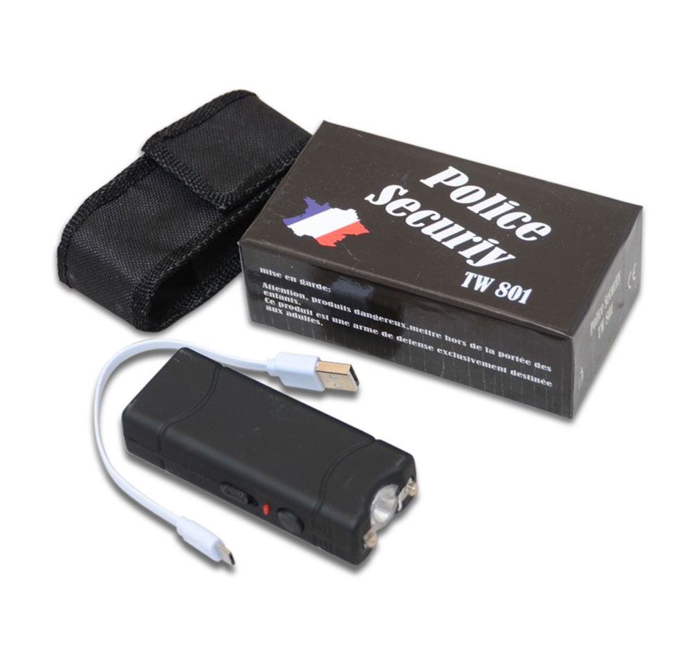 Shocker électrique noir posé devant sa boîte, avec cordon USB blanc et housse en nylon noir