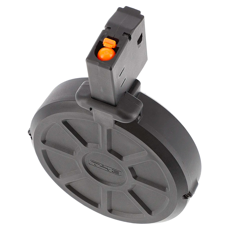 Tête du chargeur tambour T4E vue de dessus, poussoir orange visible