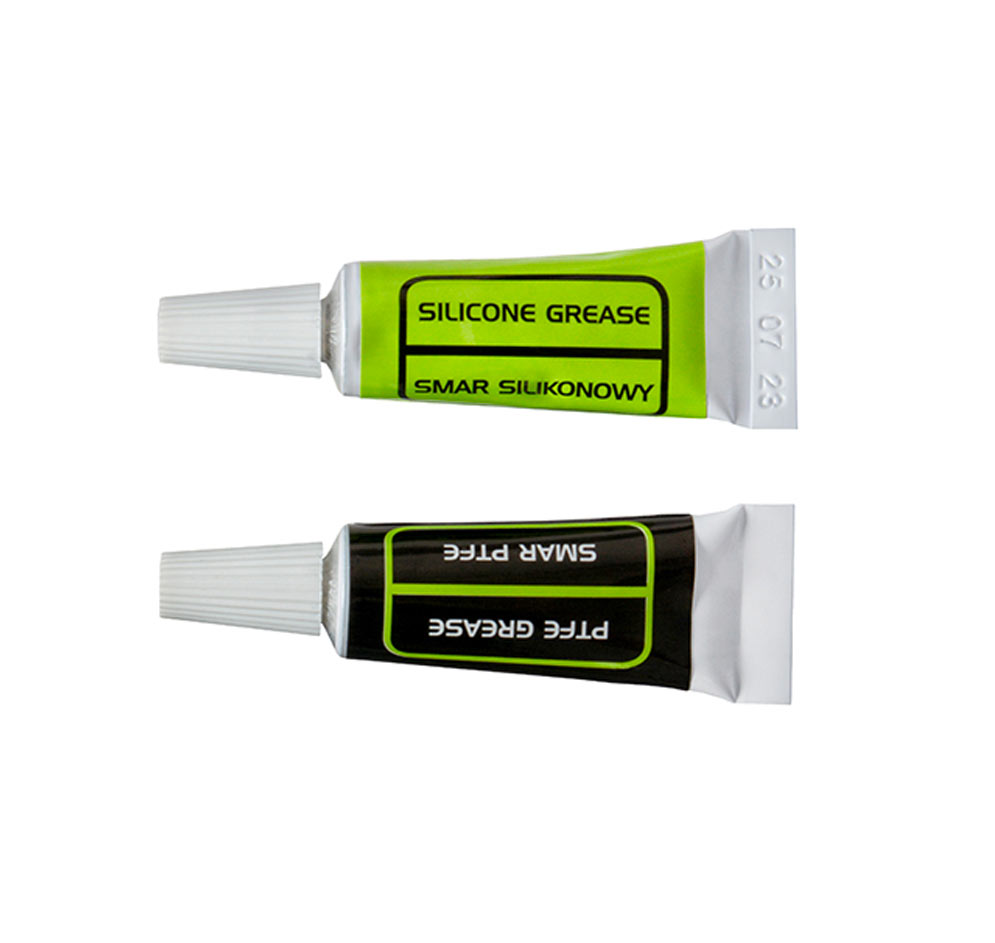 Tube vert Silicone Grease et tube noir PTFE Grease présentés l’un au-dessus de l’autre, bouchons blancs
