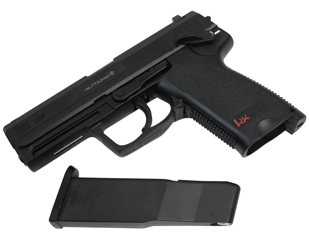 Pistolet Umarex HK USP posé à plat avec son chargeur sorti