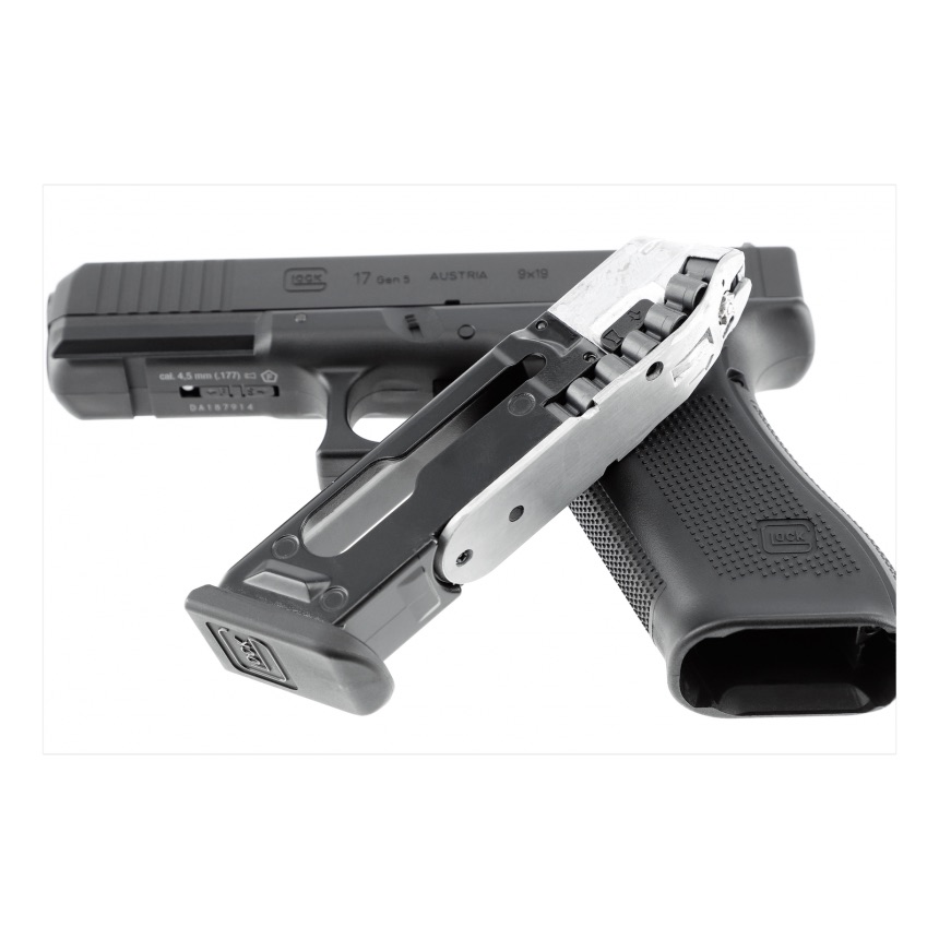 Chargeur du Glock 17 Gen5 à plombs posé contre le pistolet, puits de chargeur ouvert