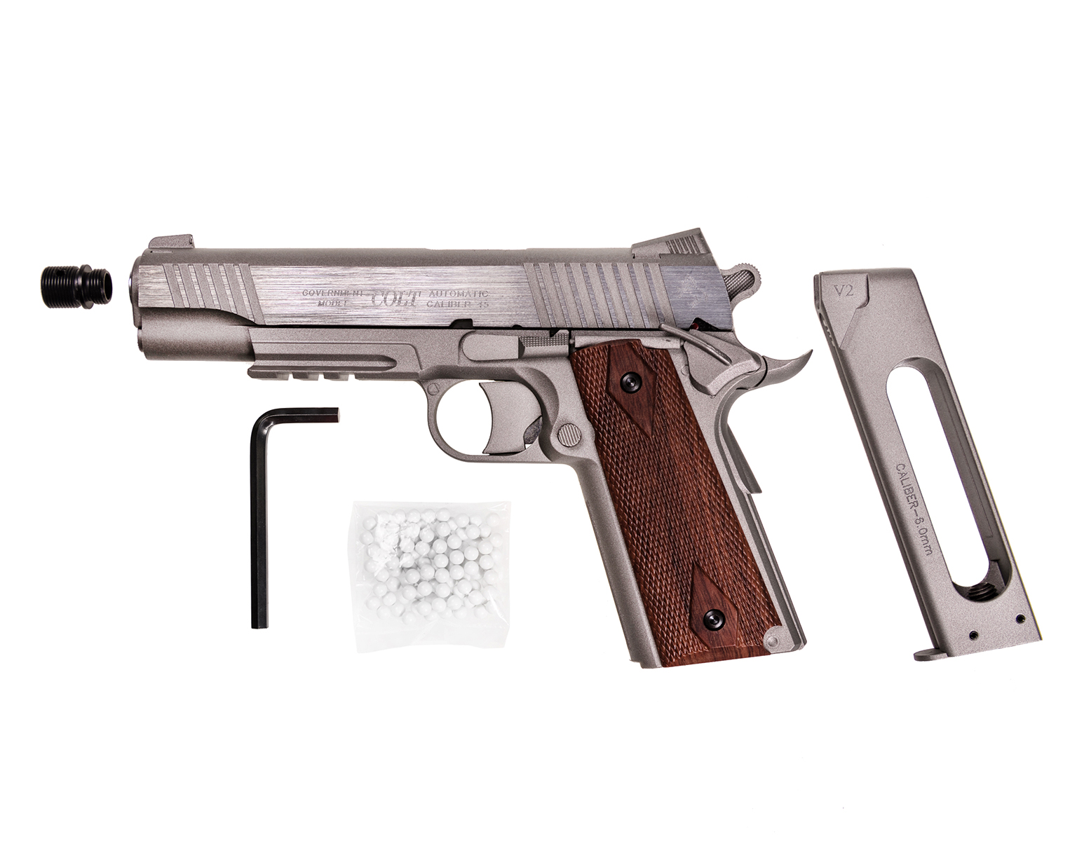 Colt Rail Gun Stainless avec son chargeur, un adaptateur de bouche noir, une clé Allen et un sachet de billes blanches