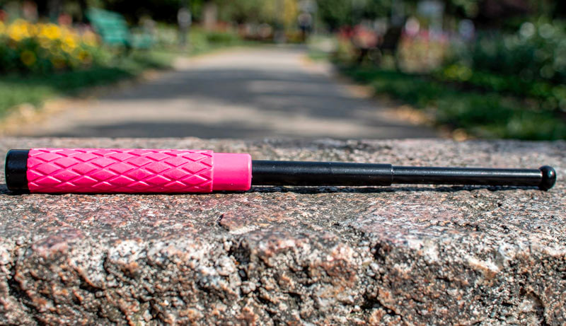 Poignée caoutchouc rose ergonomique avec étui cordura