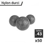 Trois billes en nylon durci gris chiné vues de près, calibre .43