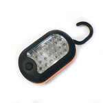 Lampe noire et orange avec son crochet noir déployé au-dessus du boîtier