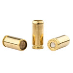 Trois cartouches à blanc 9 mm PAK de teinte laiton : opercule beige, profil et culot marqué Wadie