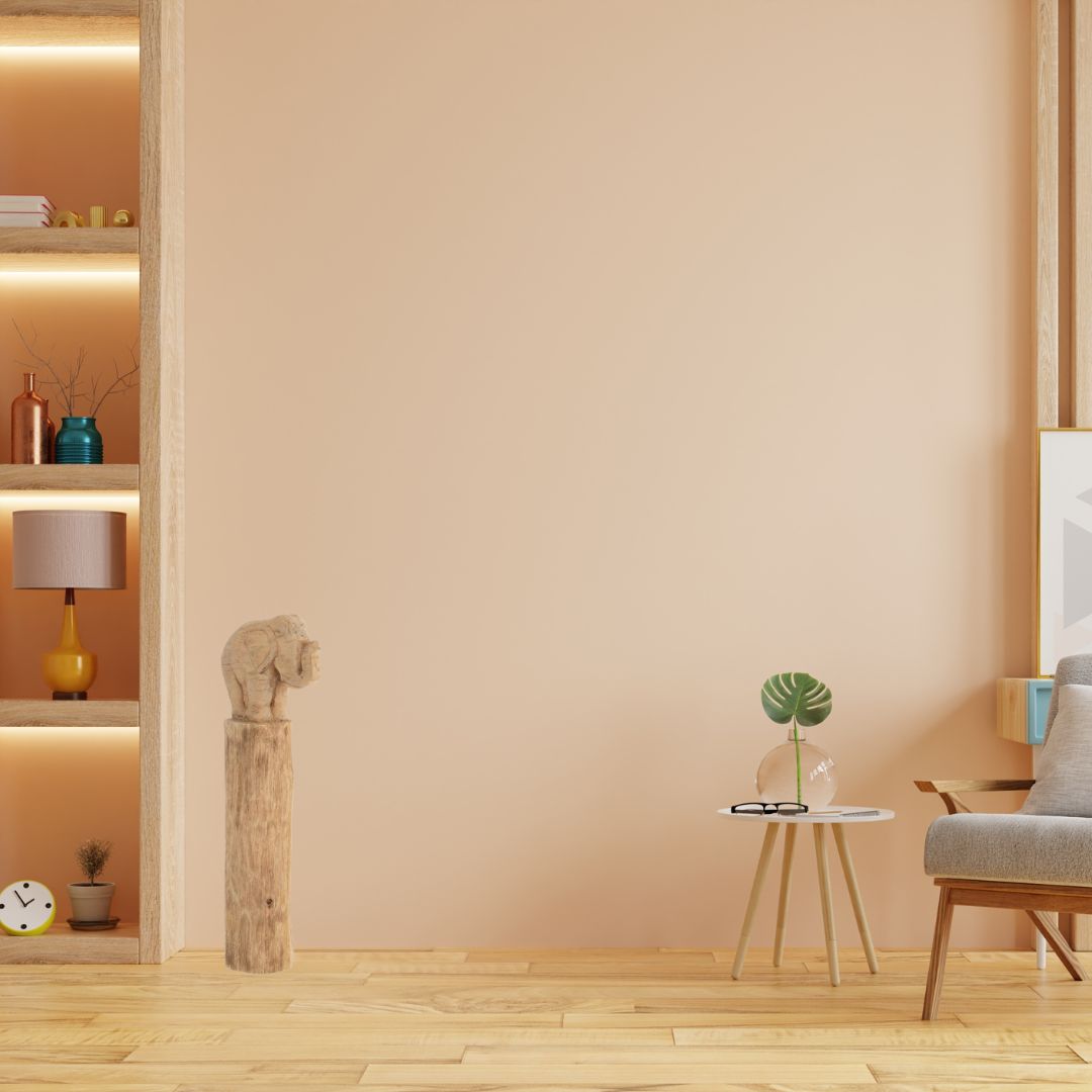 Décoration de salon avec bibliothèque, une chaise, une table et un éléphant sur une colonne