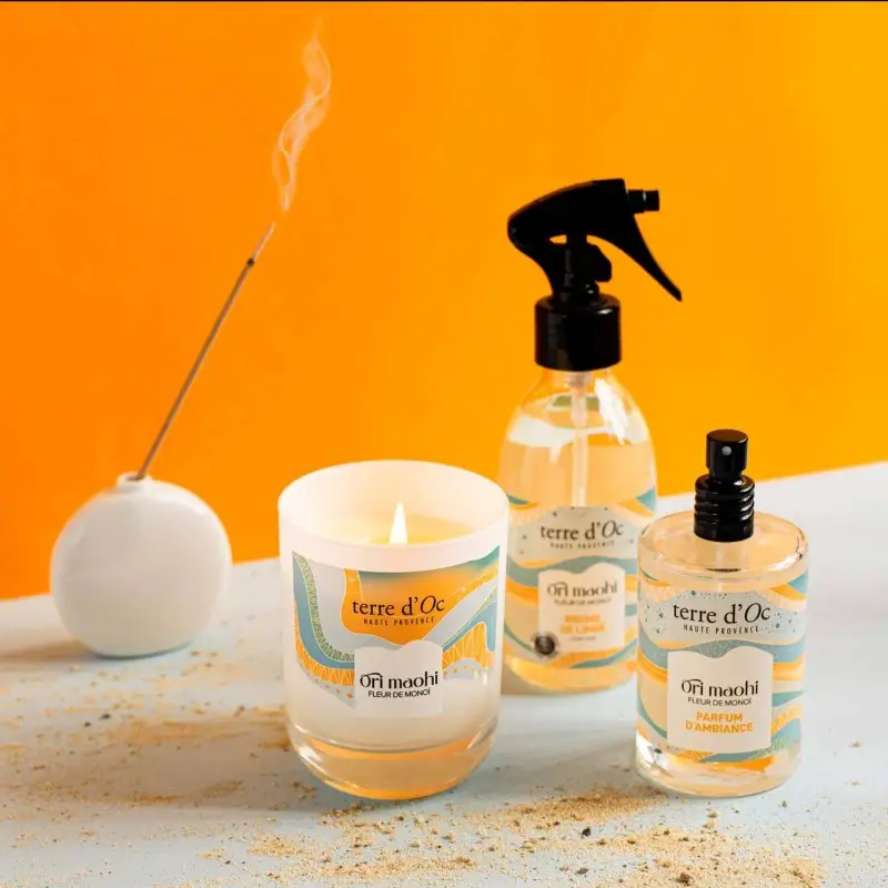 Brume de linge Fleur de monoï et une bougie