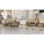 jouet qui reprèsente un train à vapeur 3d sur ses rails