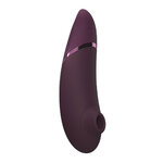 Womanizer Next violet avec ses 2 têtes de stimulation interchangeables en silicone vu de profil - Ooh My God