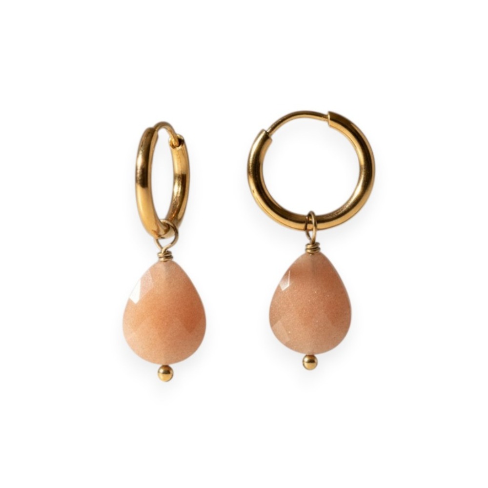 creoles pierre rose selene et acier dore exposees fond blanc