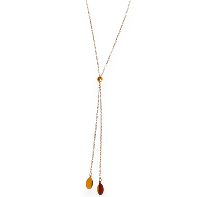 collier cravate coulissant dore style y avec fine chaine une petite boule et deux pampilles ovales plates lisses et pendantes sur fond blanc lucia