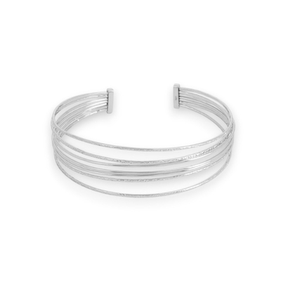 jonc semainier ouvert en acier inoxydable avec anneaux lisses et stries expose sur fond blanc laure