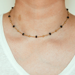 collier boule dore noir porte eleonore