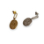 boucles d oreilles martelees une piece or et une piece argent avec anneaux trombone et pendentifs de forme ovale exposes cote a cote sur fond blanc julia