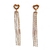 boucles d oreilles chaines pendantes en acier inoxydable dore exposees fond blanc paloma