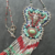 Long collier amulette ethnique