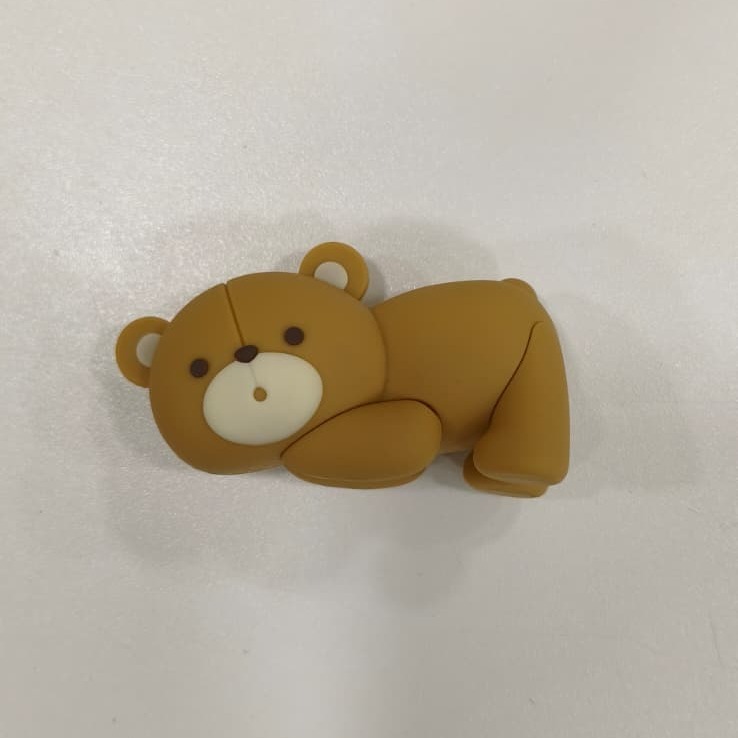 Figurine - Ourson allongé