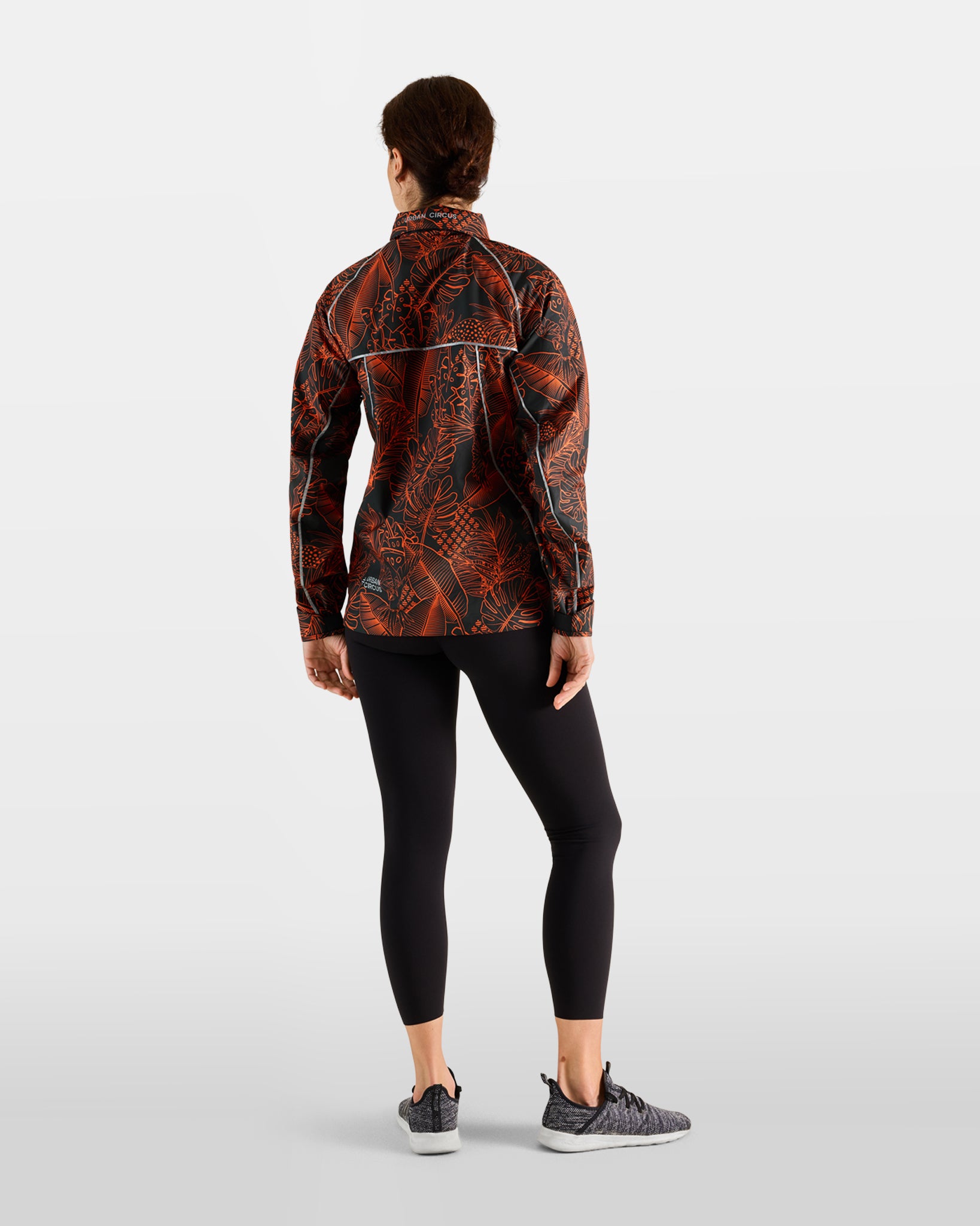 veste-sport-outdoor-legere-respirante-escapade-motif-jungle-orange-femme