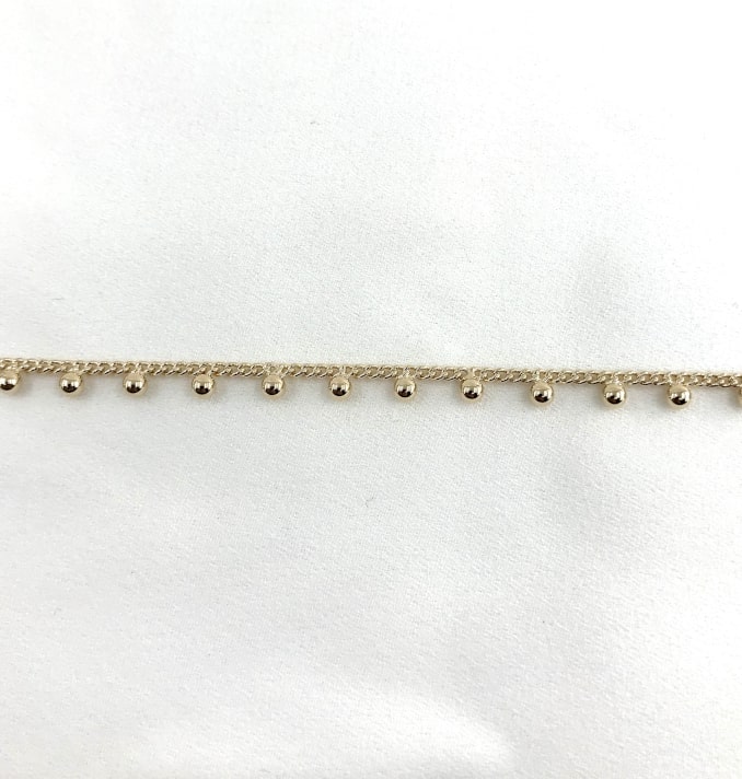 Bracelet  Adam.Bracelet en plaqué or 3 microns composé de 20 petites billes montées sur une fine chaine gourmette.