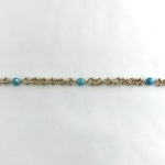 Bracelet Lily en plaqué or 3 microns composé dune chaine ronde parsemée de petites boules et de 3 pierres rondes turquoise