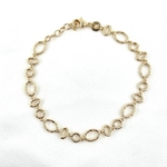 Bracelet THAIS: Bracelet martelé aux formes géométriques ovales et rondes, en plaqué or 3 microns