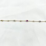 Bracelet Charles: Bracelet composé de 4 zirconiums teintés et de 4 petites boules dorées, en plaqué or 3 microns 18 carats