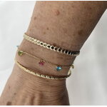 Bracelet Tom: bracelet composé dune chaine fine et de sept petits zirconiums colorés en forme de goutte.  En plaqué or 3 microns 18 carats.