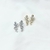 Carmen: de jolies boucles d'oreilles en forme de fleurs entièrement serties d'oxydes de zirconium. En plaqué or 3 microns et argent 925