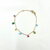 Bracelet Tom: bracelet composé d'une chaine fine et de sept petits zirconiums colorés en forme de goutte.  En plaqué or 3 microns 18 carats.